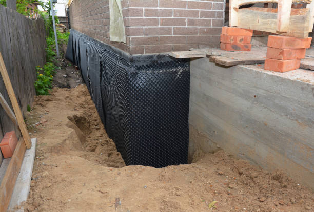 Happy homeowners after waterproofing job in Glen Ellyn